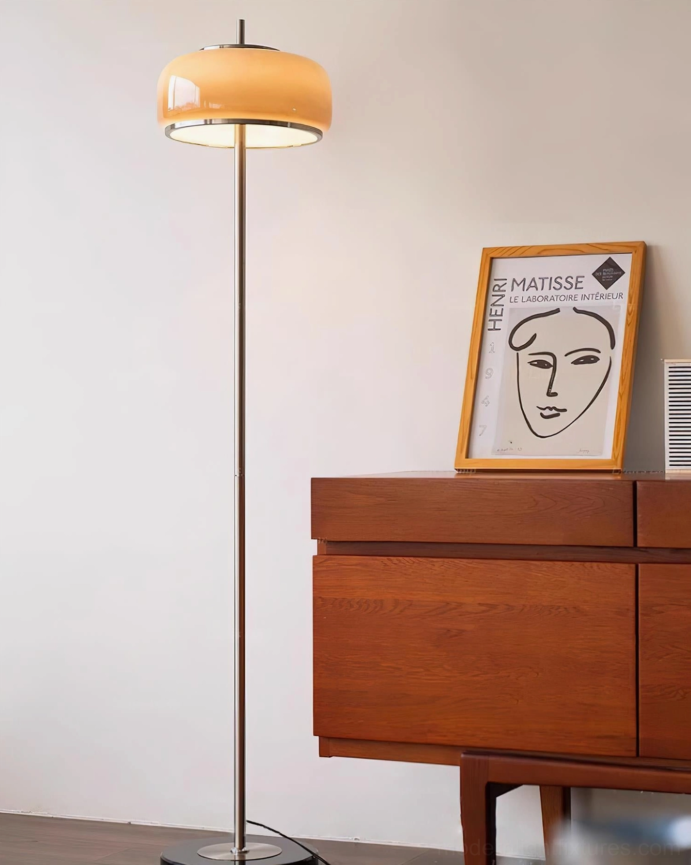 Modern minimalist floor lamp with beige glass shade suitable for Scandinavian and mid-century interior design styles