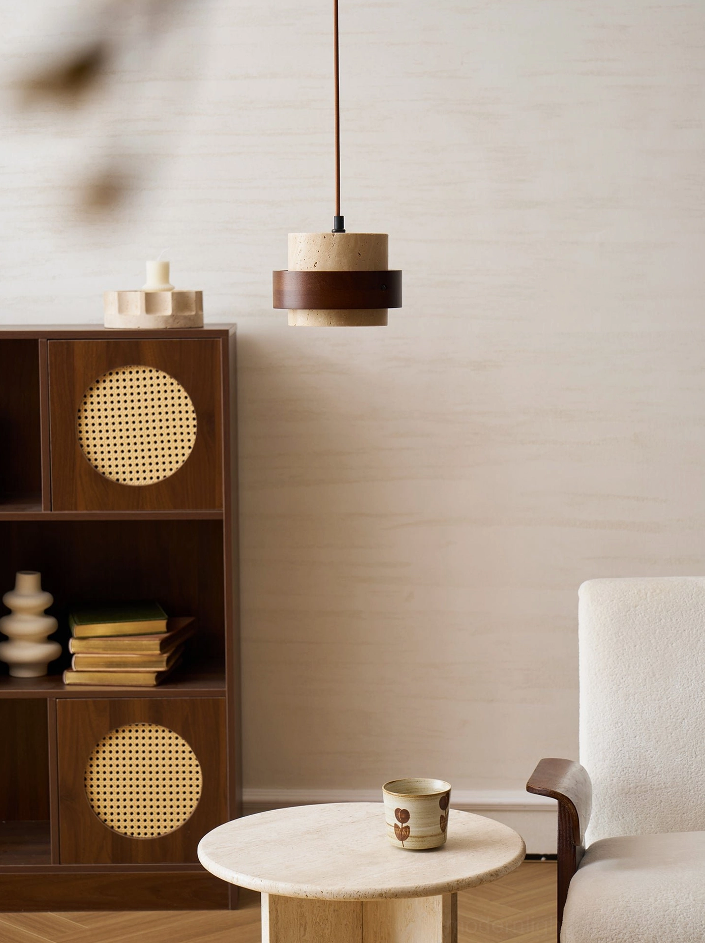 Modern minimalist pendant lamp with genuine travertine shade and walnut wood band on neutral interior background