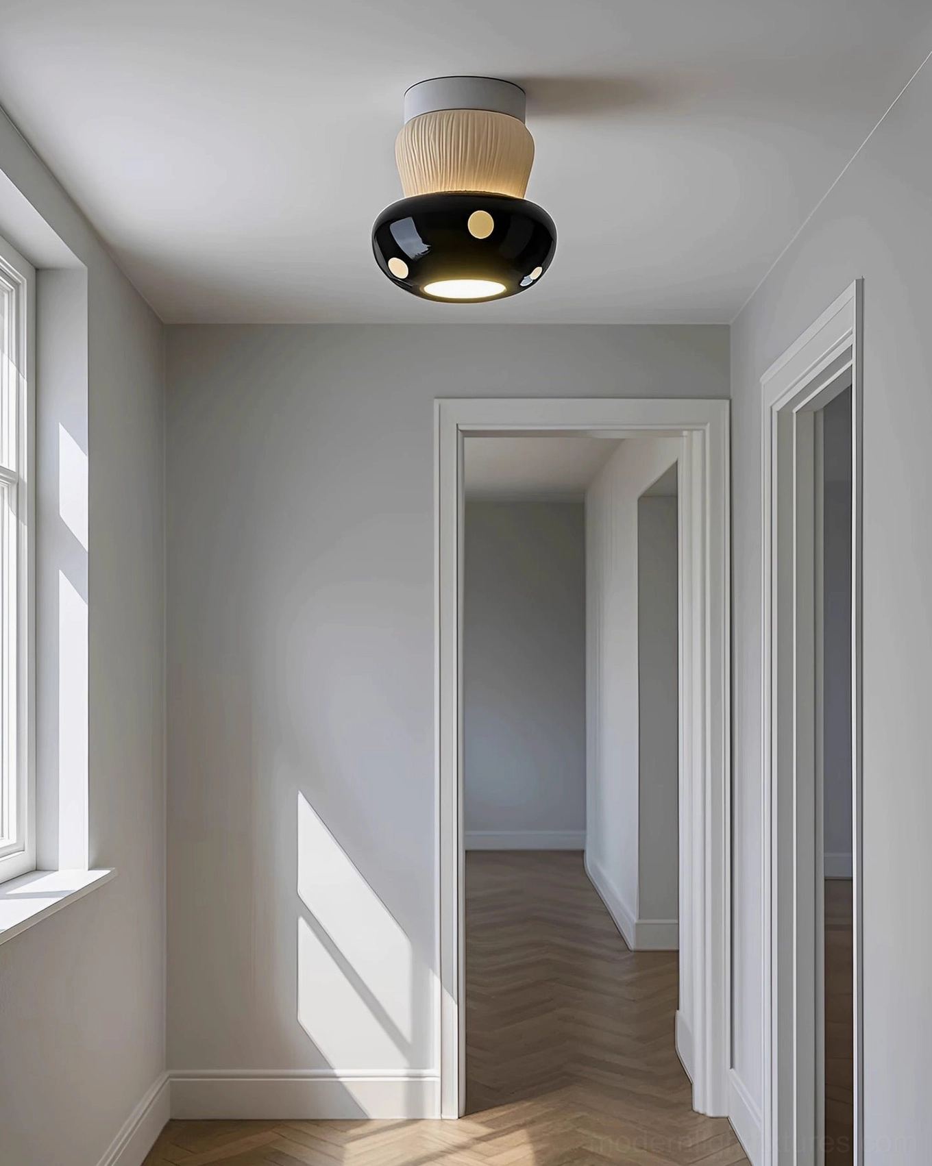 Black and white toadstool pendant ceiling lamp installed in minimalist Nordic hallway upward view