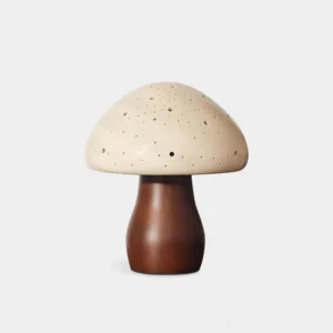 Mushroom table lamp with perforated ceramic cap and wooden stem in walnut finish - front studio view