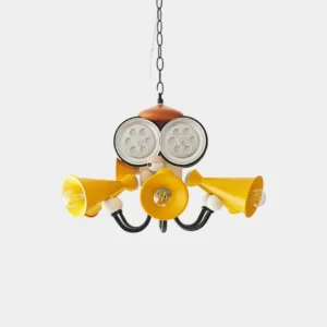 Octopus Director Chandelier front view with oversized yellow reel-inspired eye panels and black metal arms, studio photography