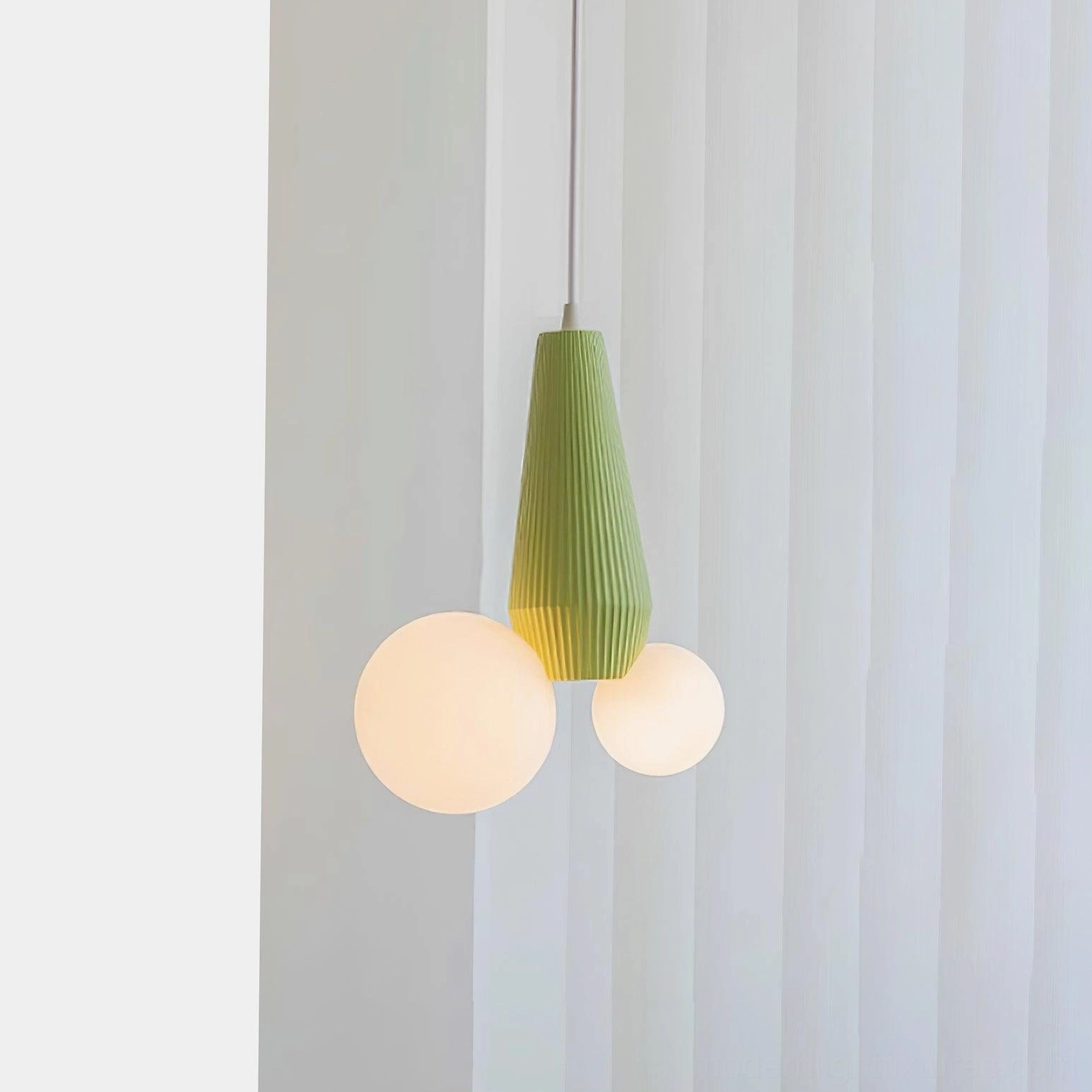 Modern pendant light with ribbed metal base and frosted glass globes - architectural detail view