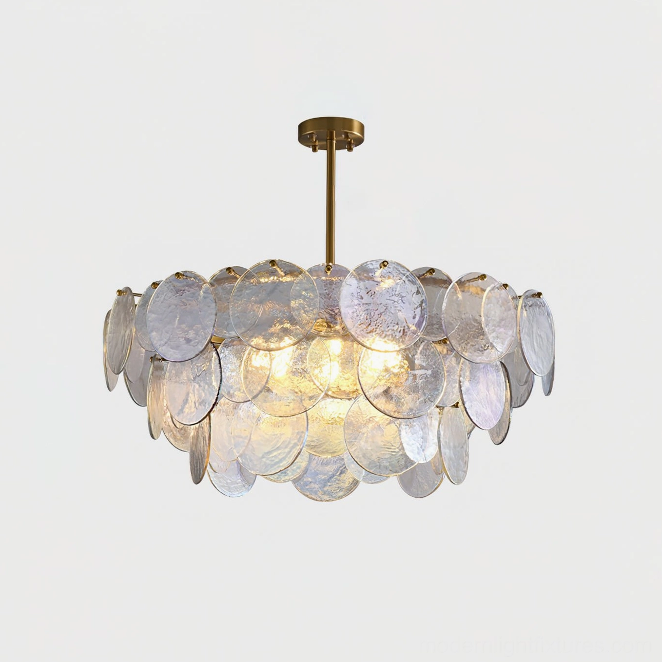 Illuminated glass disc pendant chandelier front close-up with brass top mount and G9 sockets