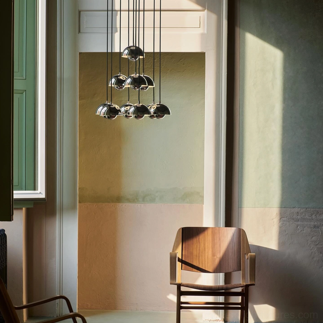 Modern pendant chandelier with multiple suspended domes showing artistic lighting composition and interior design application