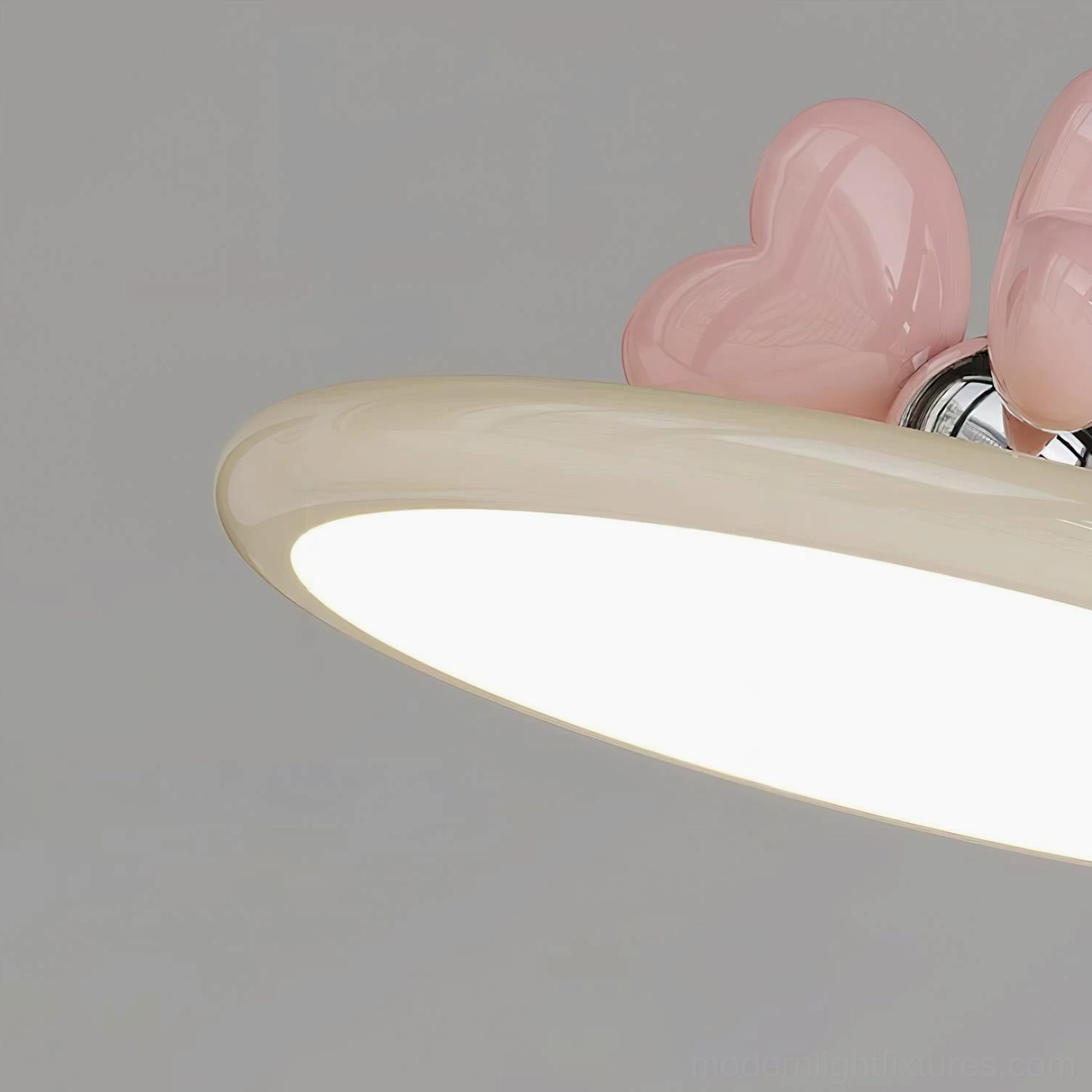 Stylish modern pendant lamp showcasing chrome metal construction and decorative heart-shaped accent