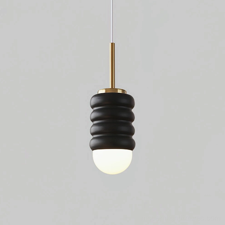 Modern pendant lamp in gold and black finish, contemporary contrast for visual depth in interiors