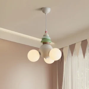 Contemporary multi-head pendant lamp installed in warm bedroom interior, overhead three-quarter angle