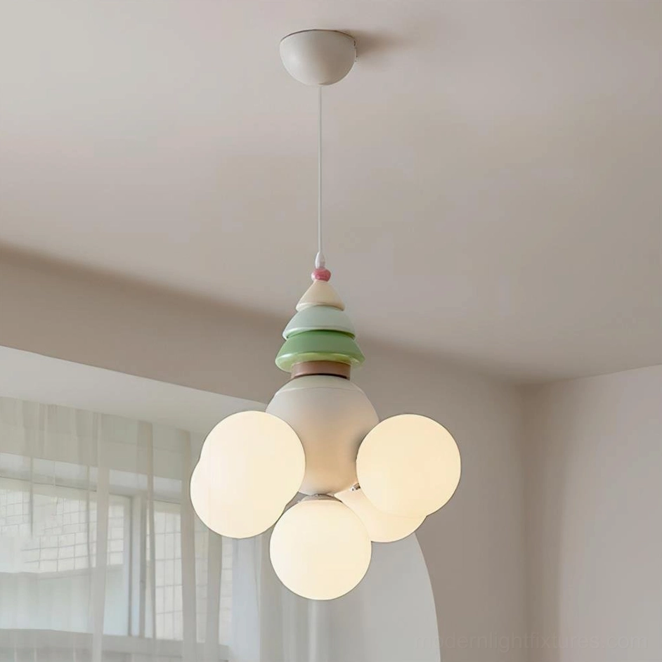 Multi-globe pendant light with illuminated frosted glass shades in bedroom with window curtains