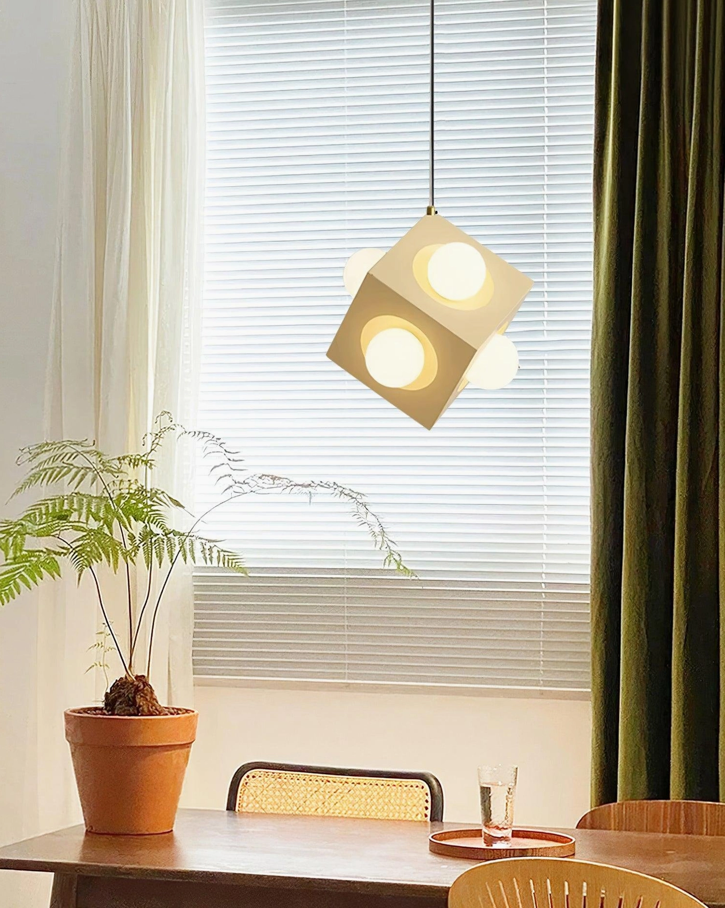 Yellow cubic pendant fixture as statement piece in modern home interior with architectural lighting design