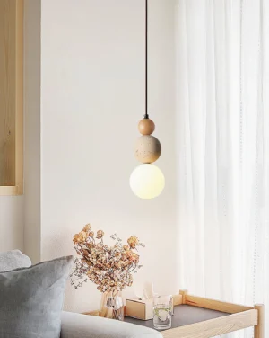 Modern stacked orb pendant lamp in cozy living room with warm ambient lighting and neutral interior design