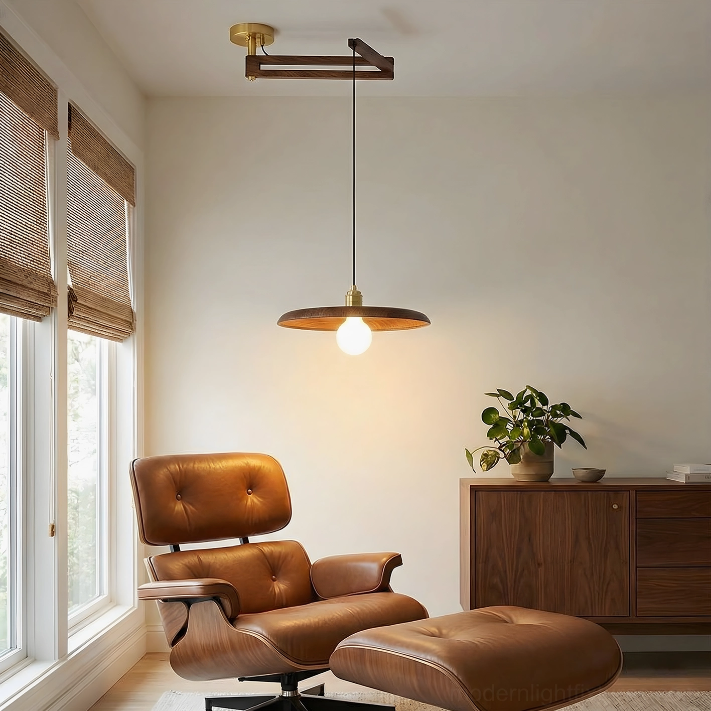 Modern lounge area with Carlyle pendant light and leather chair decor