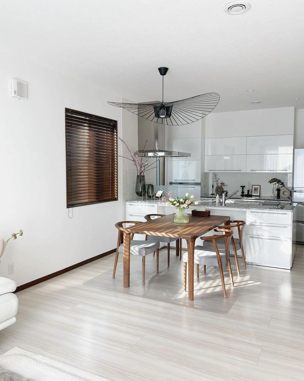 Woven fiber glass pendant lamp in contemporary minimalist interior with natural materials