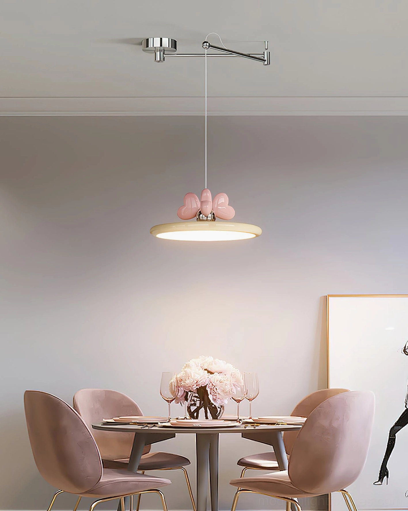 Contemporary pendant lamp in minimalist dining space with pink accent chairs and chrome arm design