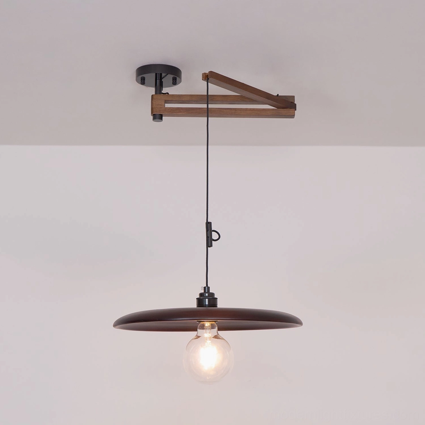 Modern dining pendant fixture creating focused task lighting