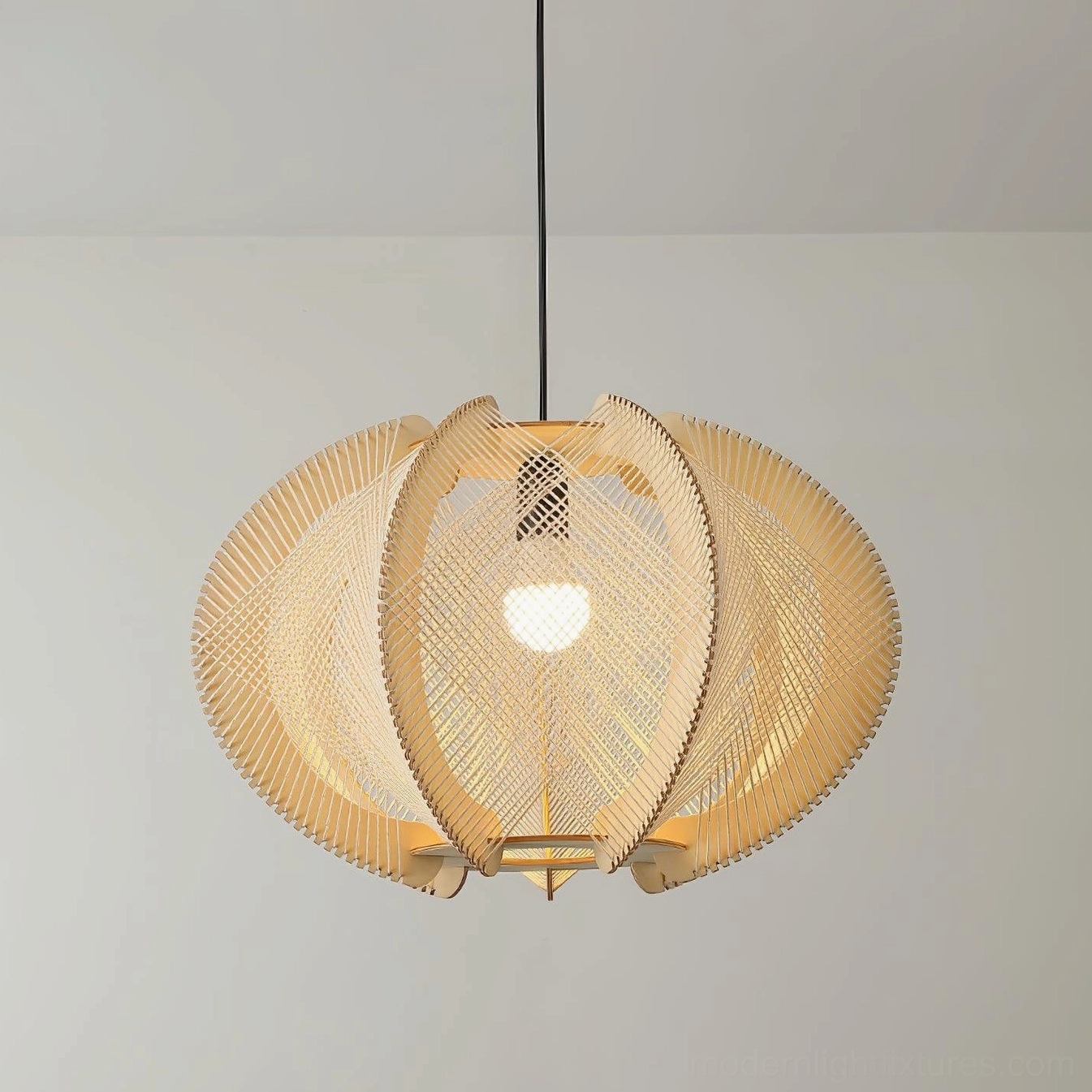 Lit woven wood pendant light casting warm ambient light with natural neutral tone