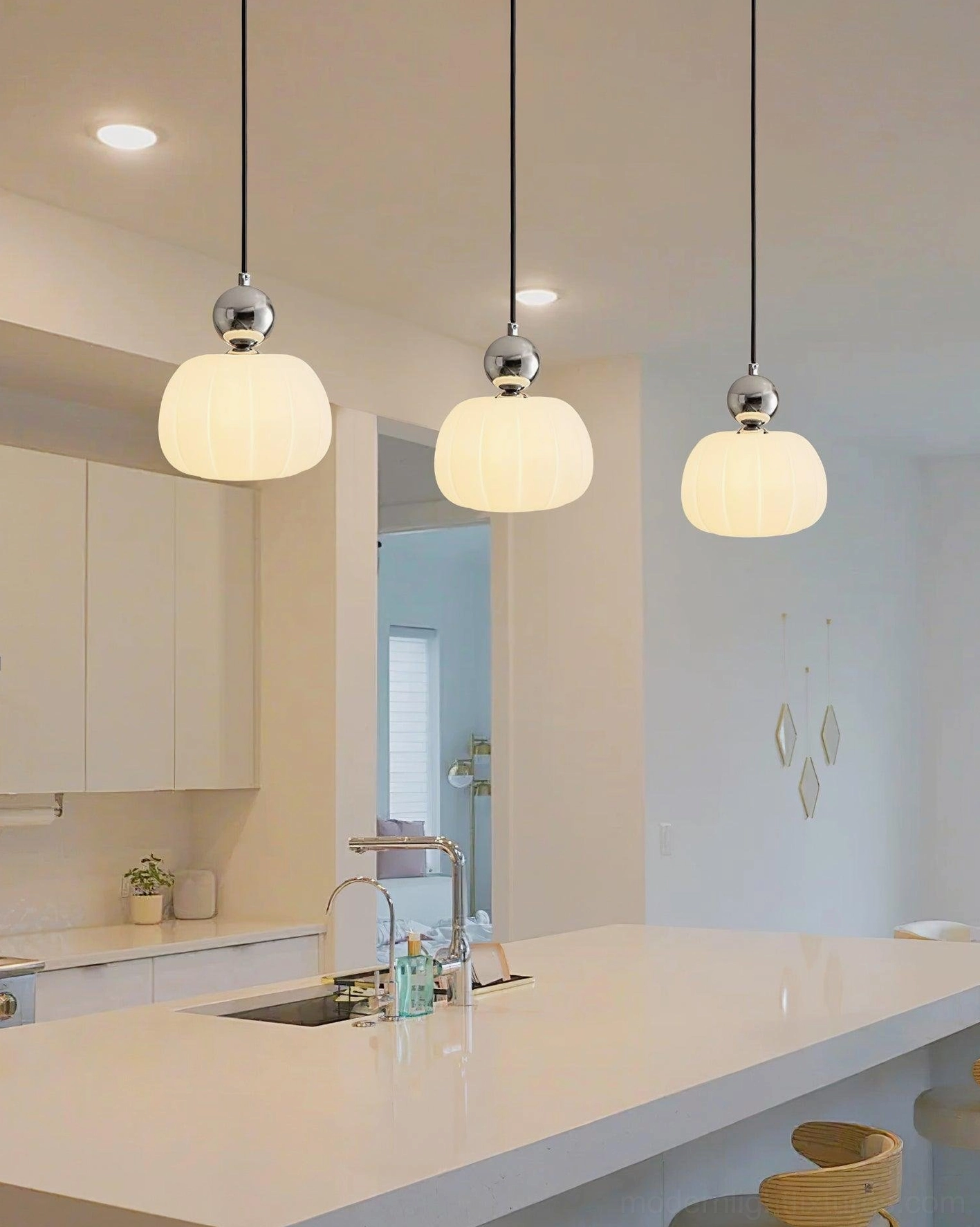 Three white Morris pendant lights suspended above kitchen island - contemporary kitchen pendant lighting installation