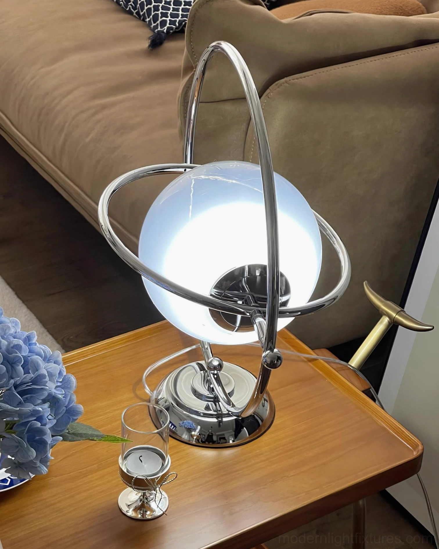 Contemporary sphere table lamp with cool white light in evening bedroom setting