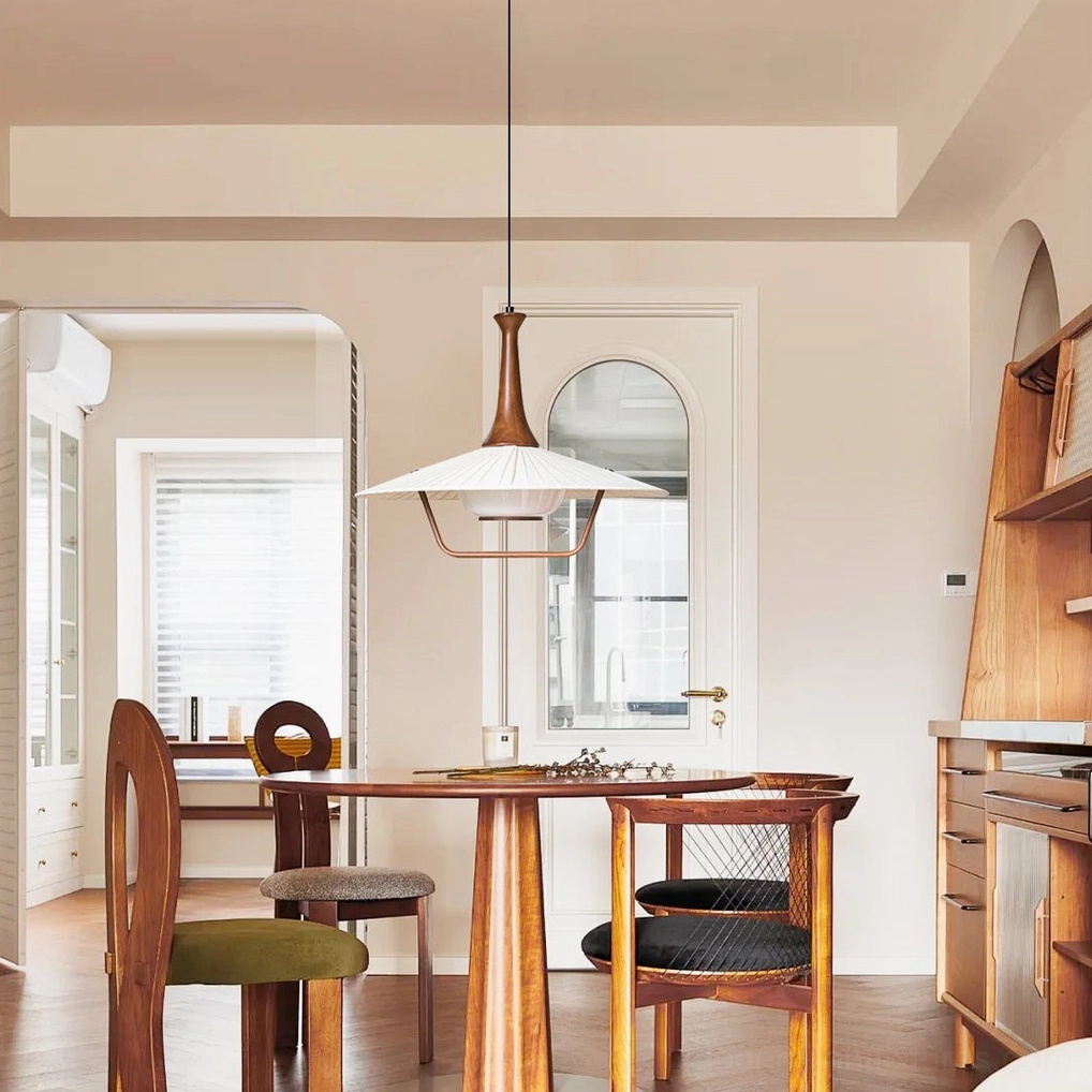 Modern pleated pendant light fixture suspended above interior surface showing scale and proportion