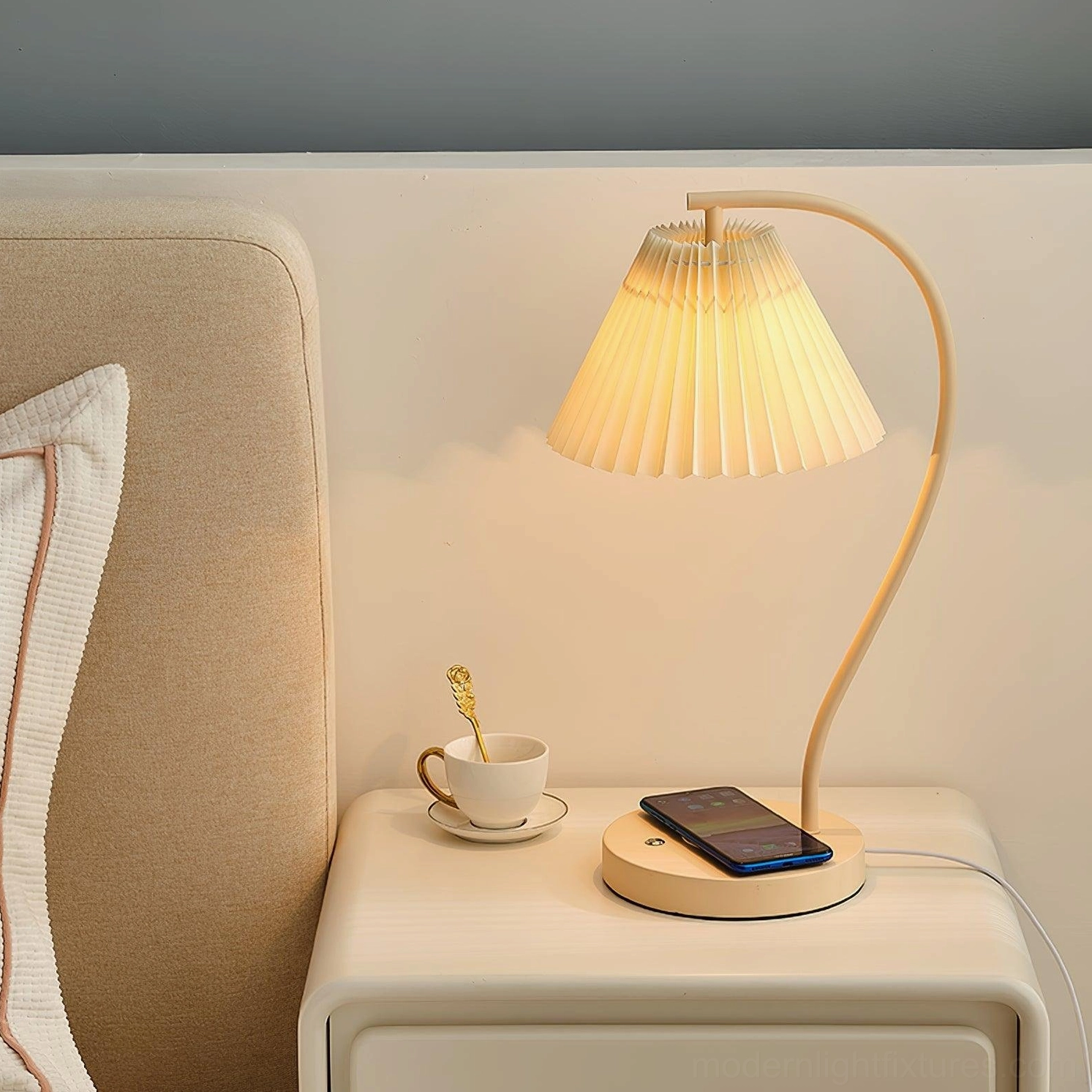 Contemporary pleated table lamp installed showing warm lighting ambiance effect
