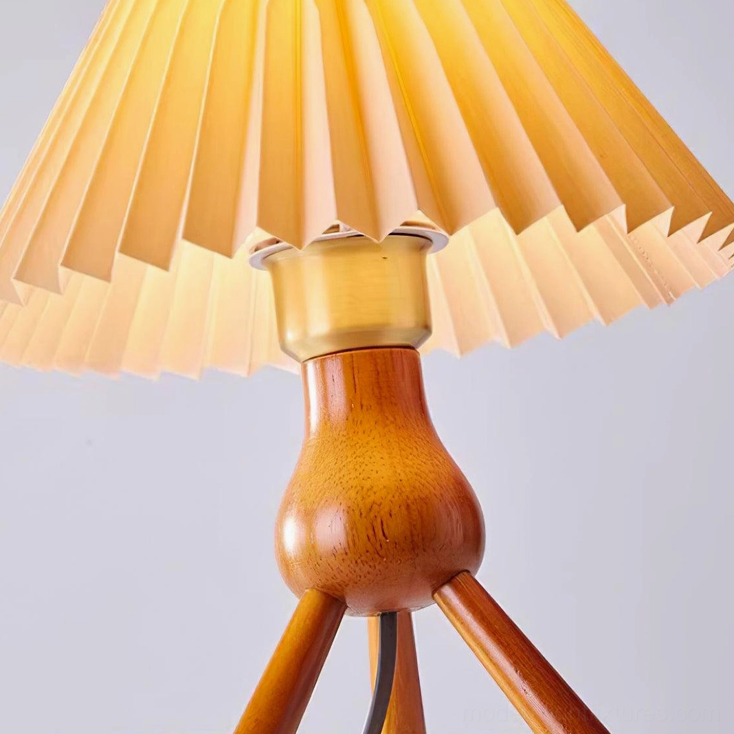 Modern pleated tripod table lamp combining mid-century aesthetics with functional design