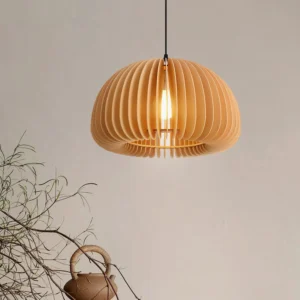 Handcrafted wood pumpkin pendant light in cozy home setting with dried flowers and wabi-sabi decor