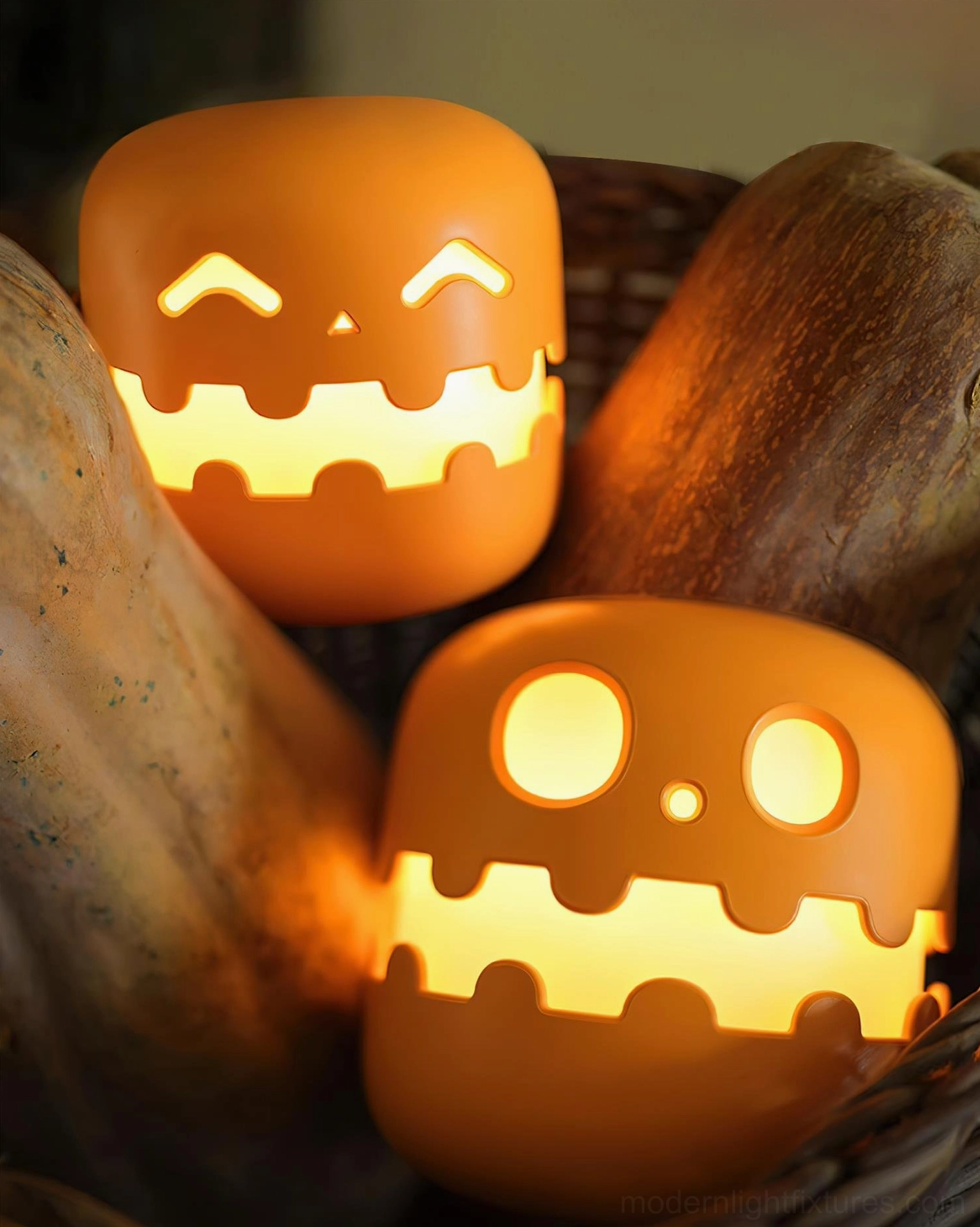 Modern pumpkin accent lamp with playful jack-o'-lantern expression, warm ambient glow