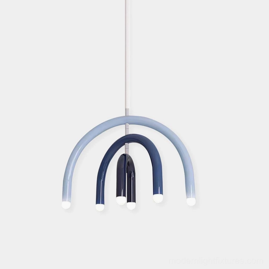 Modern rainbow arc pendant light with blue gradient curved design, minimalist studio view