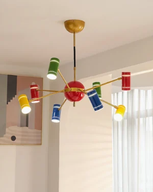 Rainbow Sputnik chandelier installed in minimalist modern living room with natural sunlight illuminating multicolor lamp covers