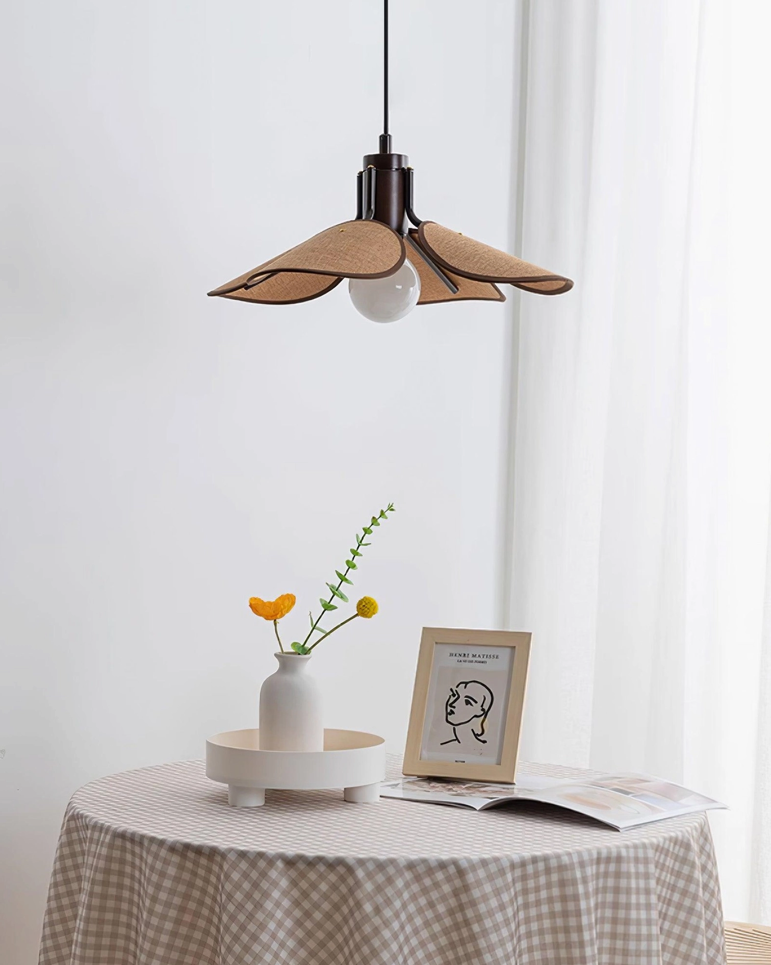 Modern rattan ceiling pendant with flower petal design in industrial minimalist space