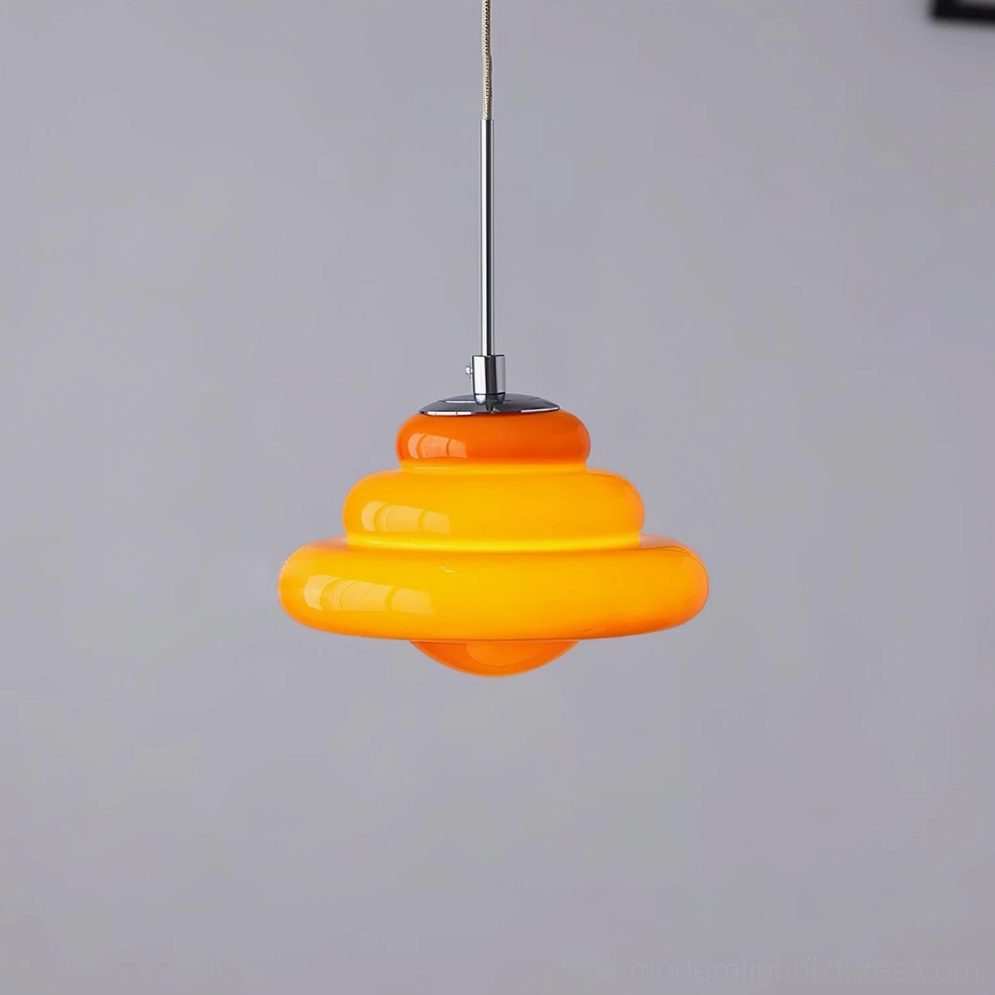 Modern retro tiered pendant lamp showing geometric design and glossy glass construction