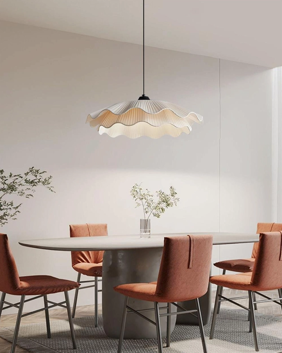 Contemporary living space with sculptural pleated pendant fixture and neutral interior design