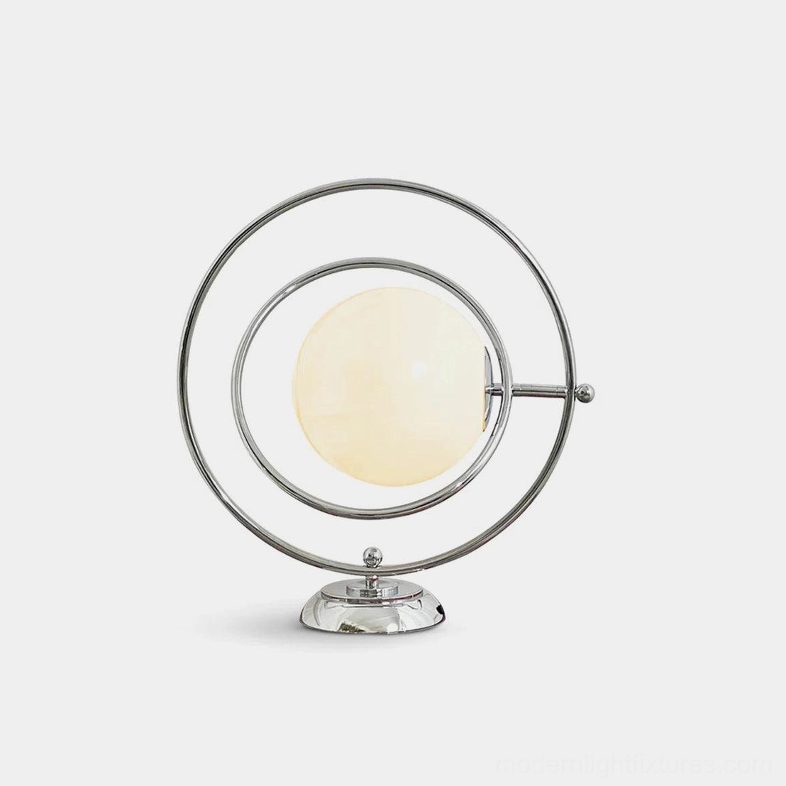 Rotating planet table lamp with chrome metal frame and white gradient frosted glass shade, modern design front view