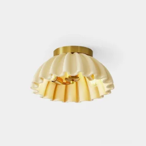Ruffle pleated ceiling light fixture with scalloped brass gold shade and cream textile on white background