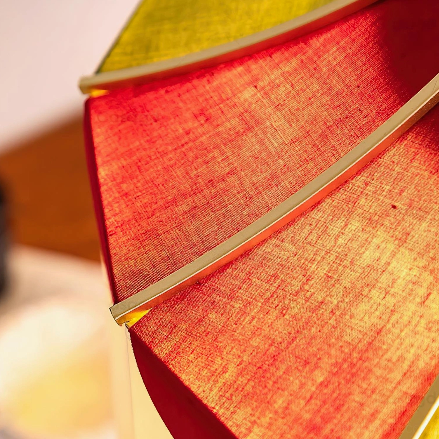 Scalloped fabric pendant light with red and green tri-color shade showing product detail and construction quality