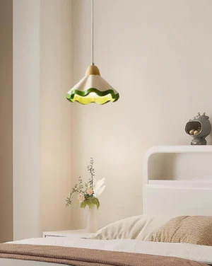 Modern scalloped resin pendant lamp hung in Nordic bedroom creating warm ambient light over bedside table