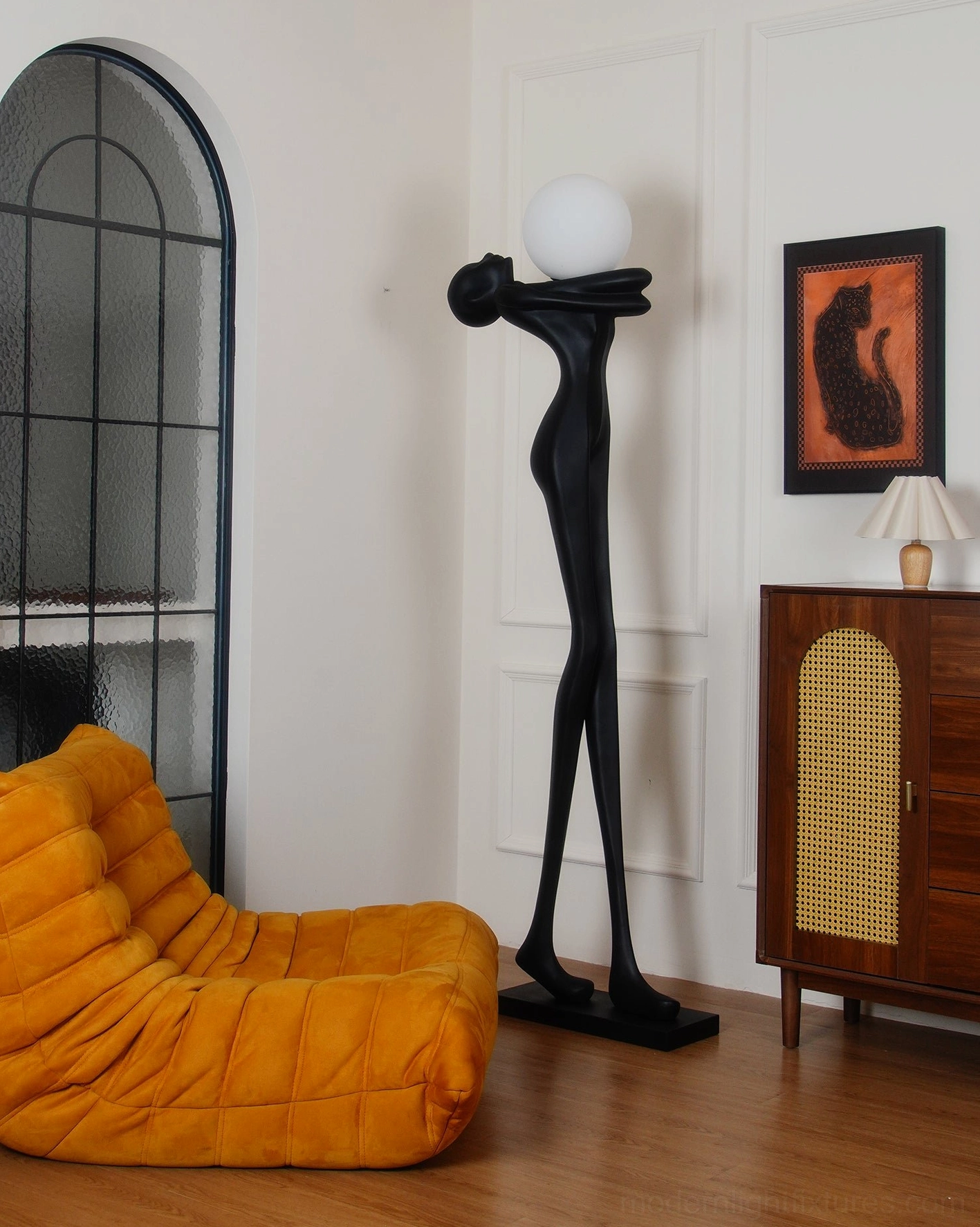 Modern sculpture floor lamp detailed view, matte black finish, artistic human silhouette design