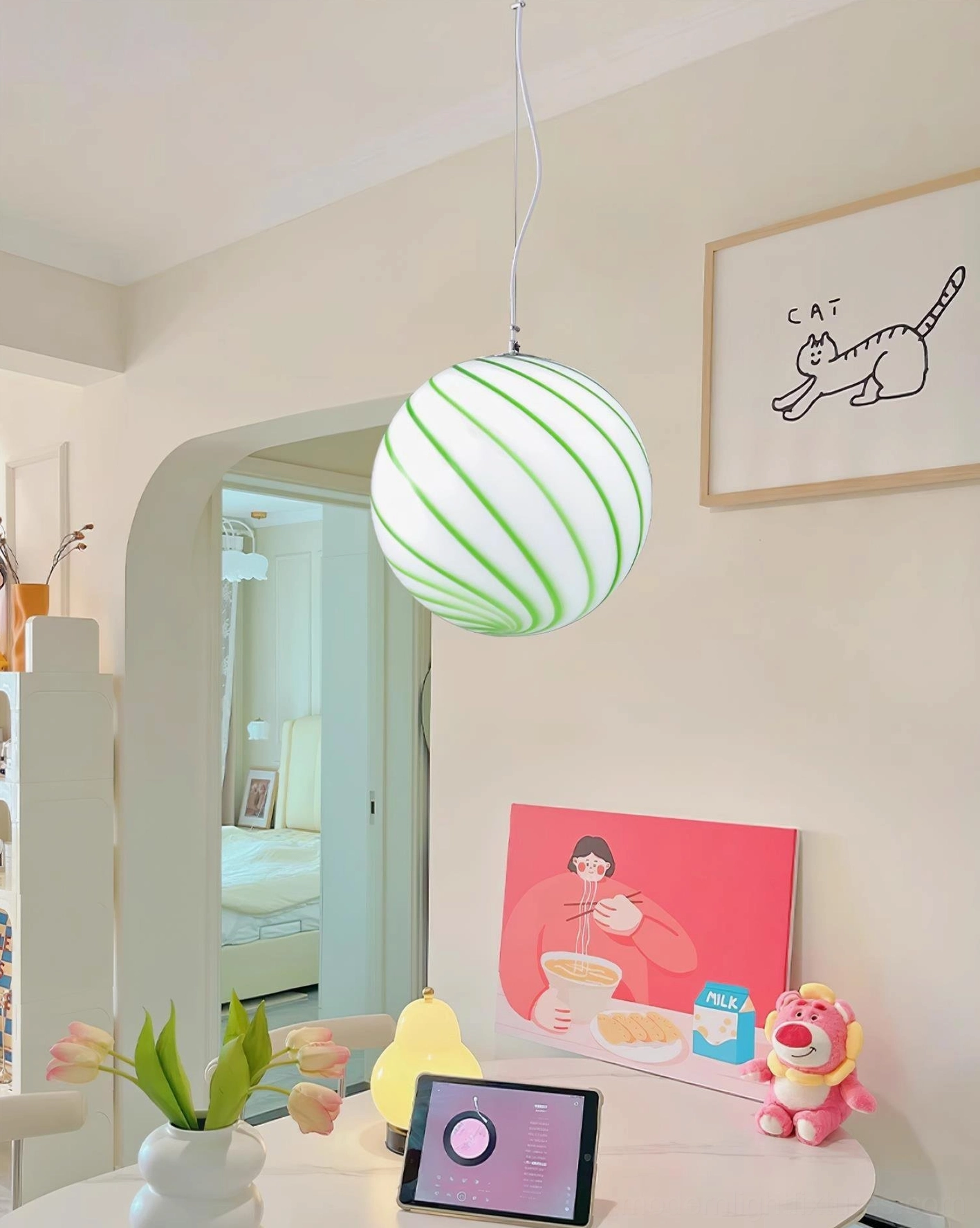 Modern spiral stripe pendant light fixture, front view of glass globe showing hand-painted stripe texture and color saturation