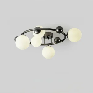 Modern flush mount sputnik light with multiple frosted glass globes arranged around black metal frame - front overhead view