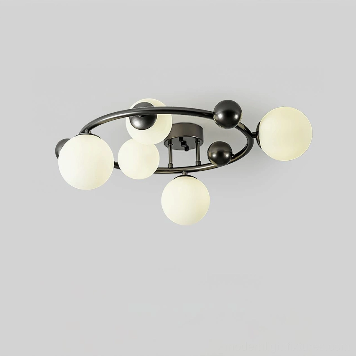 Modern flush mount sputnik light with multiple frosted glass globes arranged around black metal frame - front overhead view