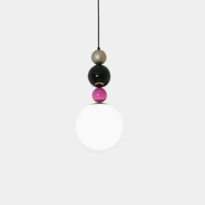 Modern stacked ball pendant light with gold, black, and pink spheres with white glass diffuser on plain white background