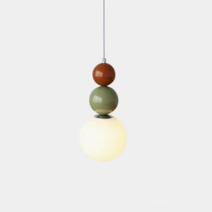 Modern stacked glass ball pendant light with three glossy white frosted spheres on neutral background