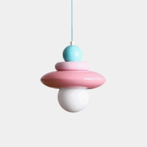Colorful stacked glass pendant light with pastel pink, blue, and white layers and exposed bulb on white background - modern sculptural hanging lamp