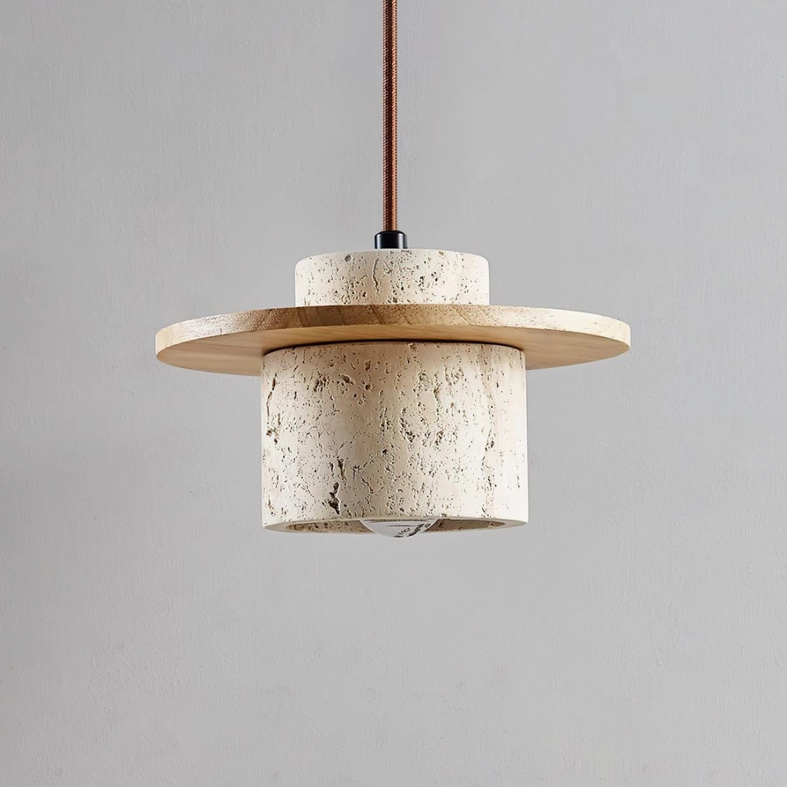 Modern stone pendant light with travertine shade and wood accents, minimalist Japandi-inspired design in contemporary kitchen