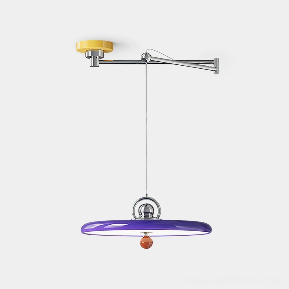 Modern swing arm pendant light with purple disc shade, polished chrome hardware, and decorative amber sphere accent - front studio view