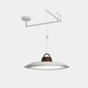 Swing arm pendant light with white metal frame and walnut wood accent, disc-shaped shade studio view