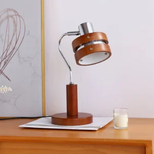 Mid-century modern desk lamp on bedside table with chrome arm and wood construction, bedroom display