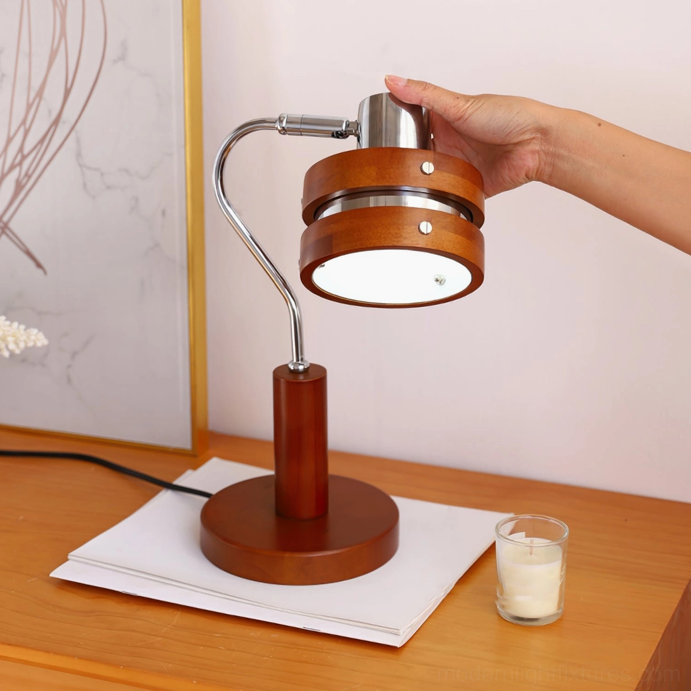 Modern table lamp with barrel-shaped wood shade and adjustable chrome arm for reading and task lighting