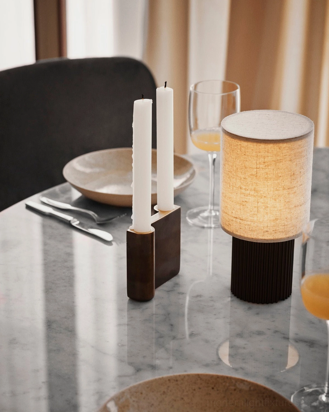 Modern minimalist table lamp in brown and white color option, three-quarter angle studio view displaying versatile contemporary design