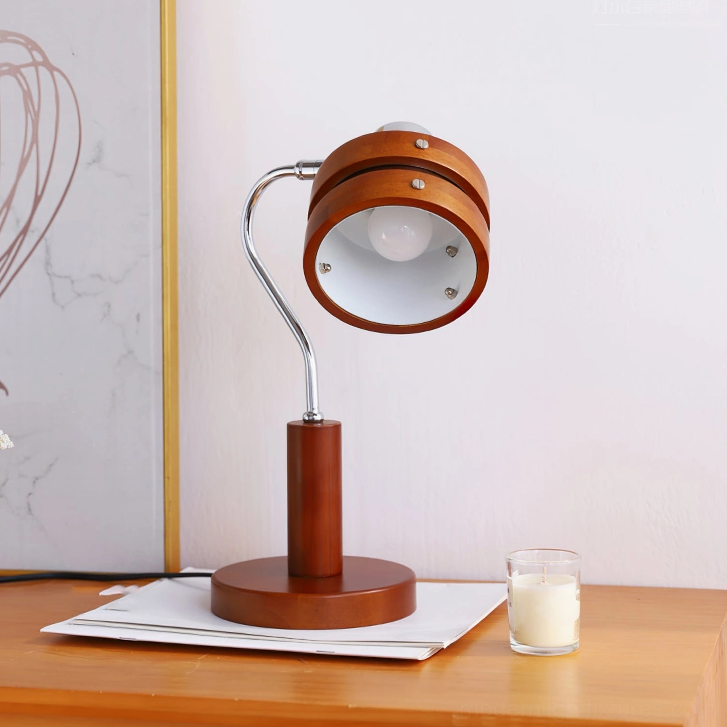 Mid-century modern table lamp detail showing polished chrome arm mechanism and wood barrel shade integration