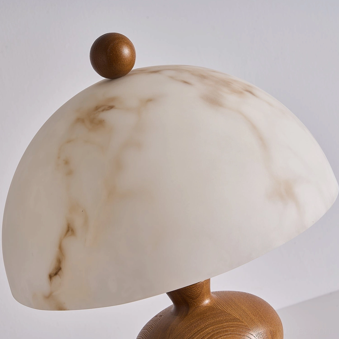Walnut and faux alabaster table lamp styled as home decor accent piece on console table with decorative objects